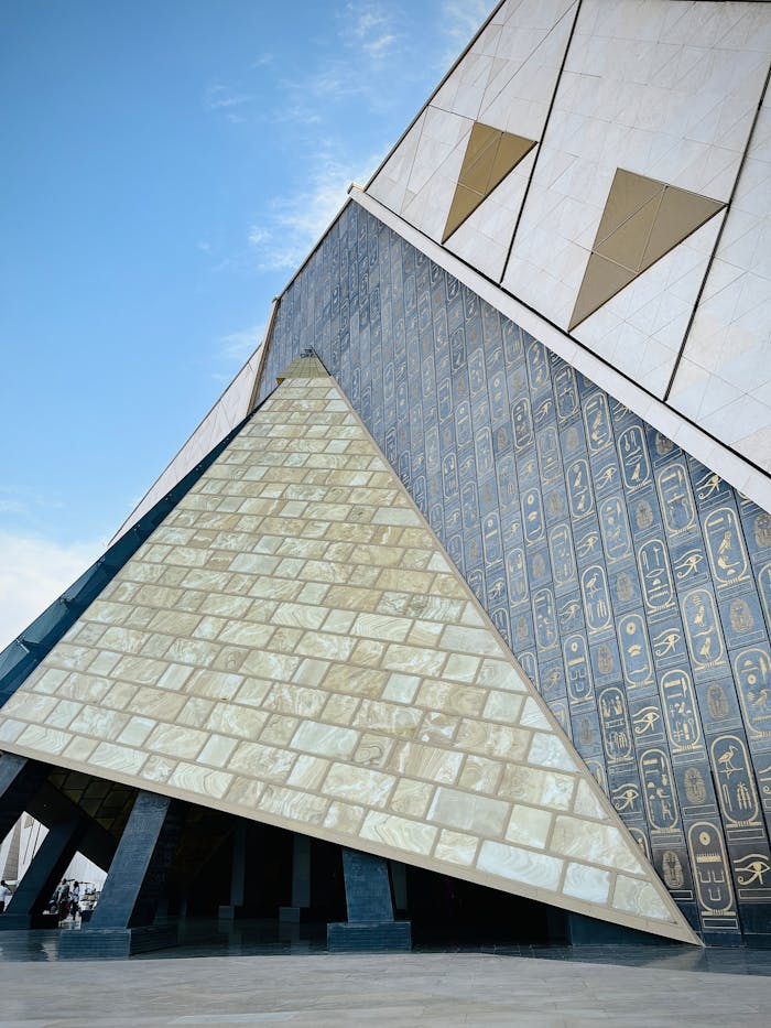 Explore the striking facade of Cairo's Grand Egyptian Museum with modern architectural elements.